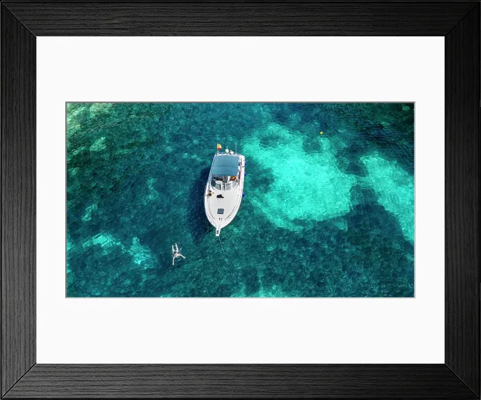 Framed Print : Aerial of a little motorboat in a bay on the Formentor Peninsula, Mallorca, Balearic islands, Spain, Mediterranean, Europe Framed Print : Aerial of a little motorboat in a bay on the Formentor Peninsula, Mallorca, Balearic islands, Spain, Mediterranean, Europe