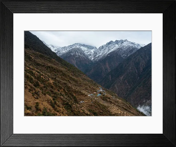 Framed Print : View along the vast valley with towering snowy mountains and Sherpagaon village on the slopes, the Langtang Valley trek, Himalayas, Nepal, Asia Framed Print : View along the vast valley with towering snowy mountains and Sherpagaon village on the slopes, the Langtang Valley trek, Himalayas, Nepal, Asia