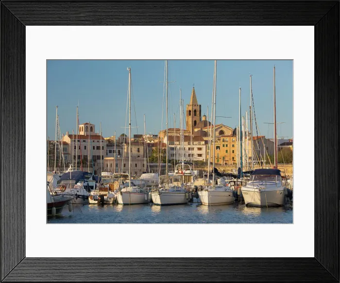Framed Print : Yachts moored in marina beneath the Old Town walls, sunrise, bell tower of the cathedral prominent on skyline, Alghero, Sassari, Sardinia, Italy, Mediterranean, Europe