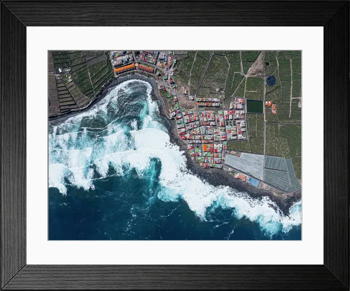 Framed Print : Vertical aerial view from the drone of a little coastal village with colorful roofs, Tenerife, Canary Islands, Spain, Atlantic, Europe Framed Print : Vertical aerial view from the drone of a little coastal village with colorful roofs, Tenerife, Canary Islands, Spain, Atlantic, Europe