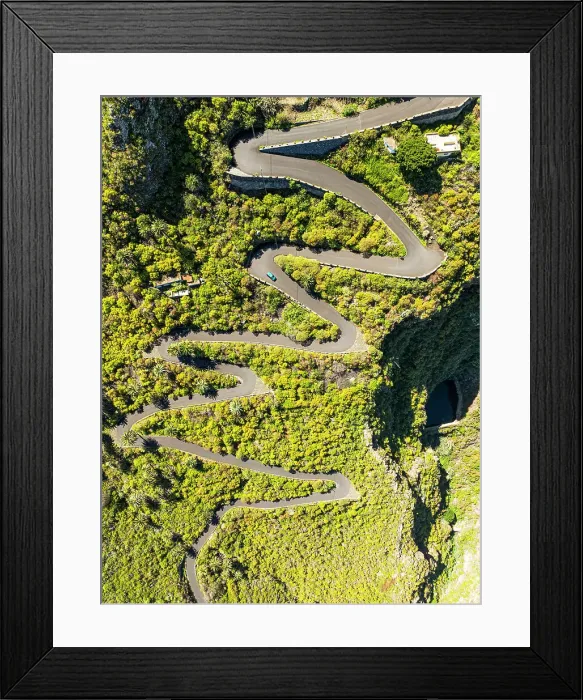 Framed Print : Vertical aerial view from the drone of a fantastic winding road on the island of Tenerife, Canary Islands, Spain, Atlantic, Europe Framed Print : Vertical aerial view from the drone of a fantastic winding road on the island of Tenerife, Canary Islands, Spain, Atlantic, Europe