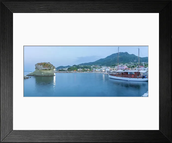 Framed Print : View of sailboat and town of Lacco Ameno at dusk, Island of Ischia, Campania, Italy, Europe Framed Print : View of sailboat and town of Lacco Ameno at dusk, Island of Ischia, Campania, Italy, Europe