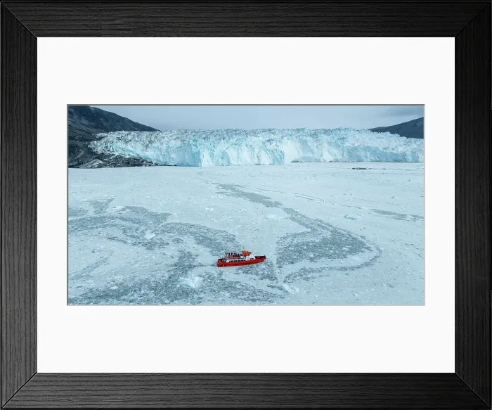Framed Print : Aerial of a little ship floating between the ice below the Eqi glacier, Western Greenland, Denmark, Polar Regions Framed Print : Aerial of a little ship floating between the ice below the Eqi glacier, Western Greenland, Denmark, Polar Regions