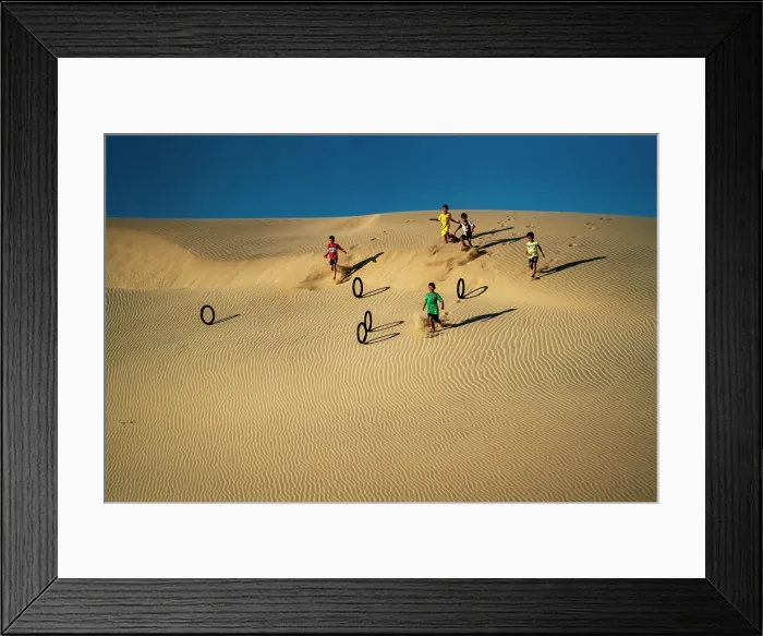 Framed Print : Children rolling tyres as hoops down the Nam Cuong sand hill in Ninh Thuan, Vietnam, Indochina, Southeast Asia, Asia Framed Print : Children rolling tyres as hoops down the Nam Cuong sand hill in Ninh Thuan, Vietnam, Indochina, Southeast Asia, Asia