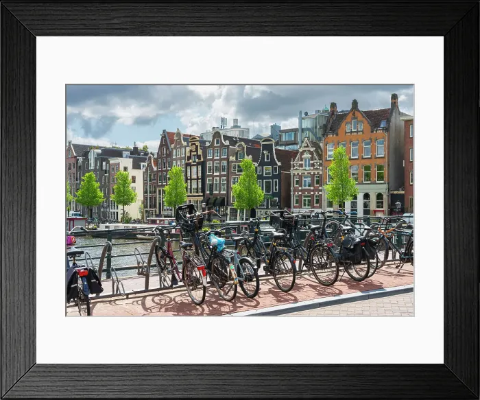 Framed Print : Bicycles with houses by Amstel River in the background, Amsterdam, The Netherlands, Europe Framed Print : Bicycles with houses by Amstel River in the background, Amsterdam, The Netherlands, Europe