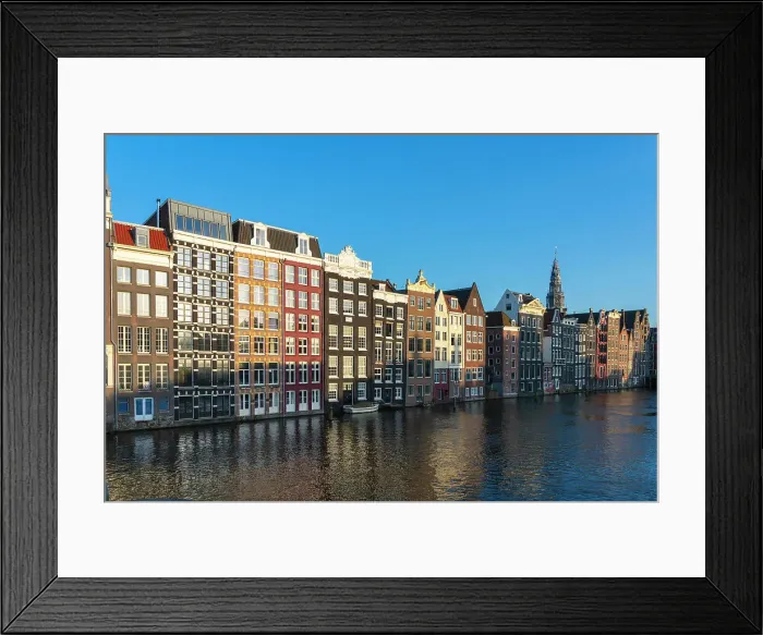 Framed Print : Dancing houses at Damrak and tower of Oude Kerk Amsterdam Church at sunset, Amsterdam, The Netherlands, Europe Framed Print : Dancing houses at Damrak and tower of Oude Kerk Amsterdam Church at sunset, Amsterdam, The Netherlands, Europe