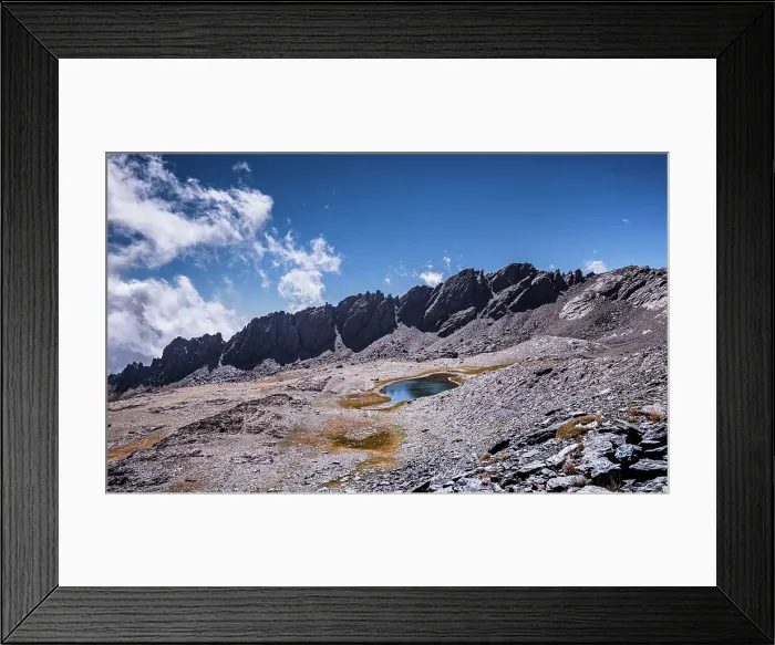 Framed Print : Dramatic rugged mountain range with a lake, Laguna del Rio Secco and Pico del Pulpito, Sierra Nevada, Andalusia, Spain, Europe