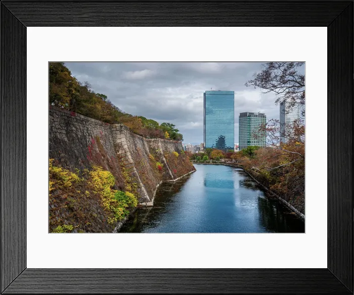 Framed Print : View along the inner Osaka Castle moat with autumnal trees and Crystal tower and CBD in the background, Osaka, Honshu, Japan, Asia Framed Print : View along the inner Osaka Castle moat with autumnal trees and Crystal tower and CBD in the background, Osaka, Honshu, Japan, Asia