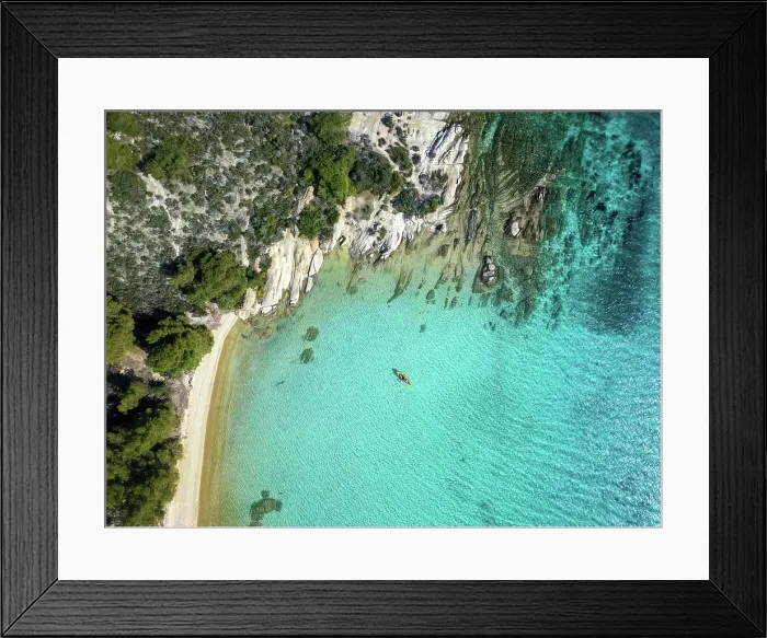 Framed Print : Diaporos island with wild beaches and a kayak on the turquoise water, drone top aerial view, Chalkidiki, Greece Framed Print : Diaporos island with wild beaches and a kayak on the turquoise water, drone top aerial view, Chalkidiki, Greece