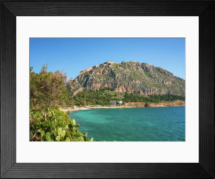 Framed Print : Arvanitias beach in historic city of Nafplion with Palamidi fortress on top of the mountain, Nafplion, Peloponnese, Greece Framed Print : Arvanitias beach in historic city of Nafplion with Palamidi fortress on top of the mountain, Nafplion, Peloponnese, Greece