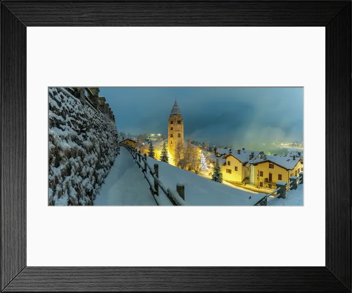 Framed Print : Church of Saint Pantalon and snow covered town centre and mountainous background in winter at dusk, Courmayeur, Aosta Valley, Italian Alps, Italy
