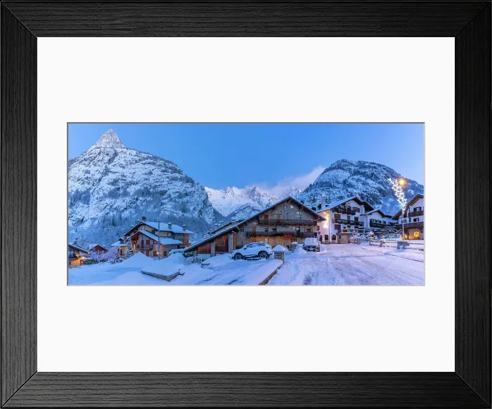 Framed Print : View of chalets and snow covered mountains in Courmayeur before dawn in winter, Courmayeur, Aosta Valley, Italian Alps, Italy