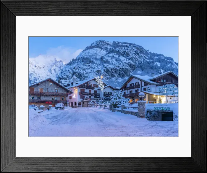 Framed Print : View of chalets and snow covered mountains in Courmayeur before dawn in winter, Courmayeur, Aosta Valley, Italian Alps, Italy