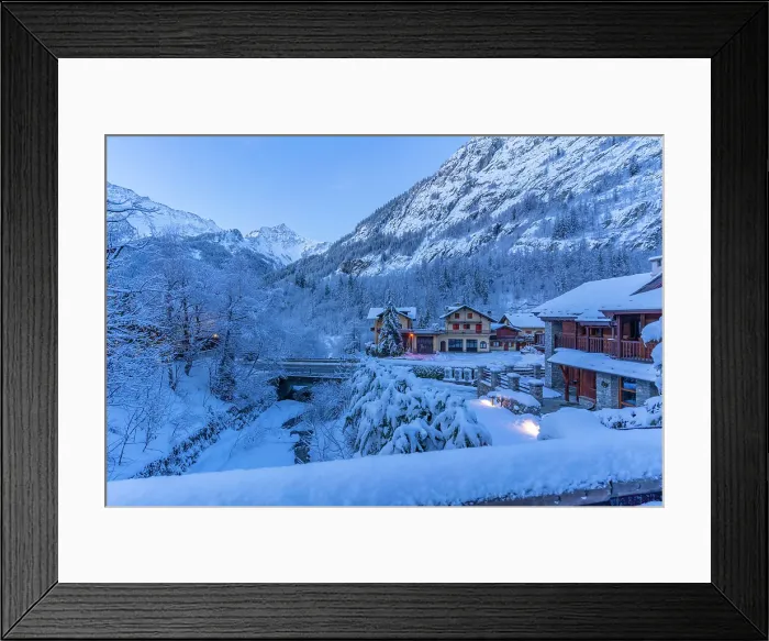 Framed Print : View of chalets and snow covered mountains in Courmayeur before dawn in winter, Courmayeur, Aosta Valley, Italian Alps, Italy