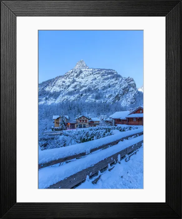 Framed Print : View of chalets and snow covered mountains in Courmayeur before dawn in winter, Courmayeur, Aosta Valley, Italian Alps, Italy
