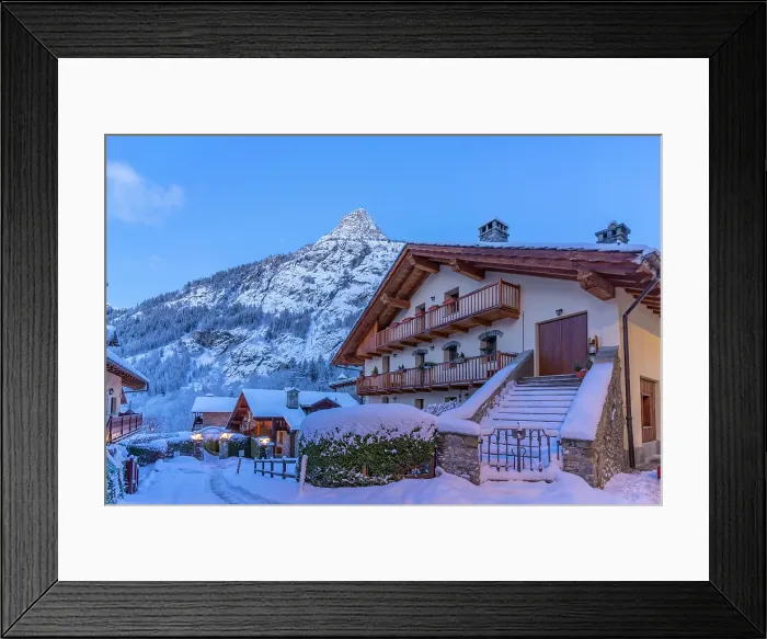 Framed Print : View of chalets and snow covered mountains in Courmayeur before dawn in winter, Courmayeur, Aosta Valley, Italian Alps, Italy