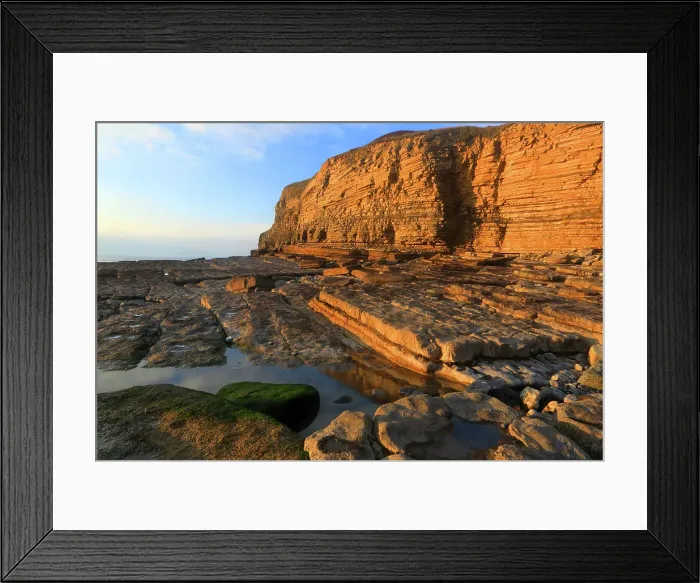 Framed Print : Golden evening light on the cliffs in winter at Dunraven Bay, Southerndown, Bridgend, South Wales, United Kingdom Framed Print : Golden evening light on the cliffs in winter at Dunraven Bay, Southerndown, Bridgend, South Wales, United Kingdom