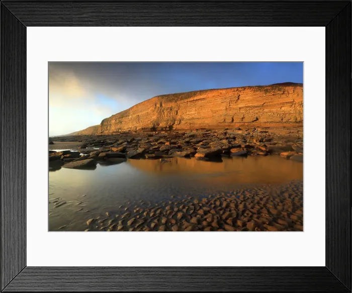 Framed Print : Golden evening light on the cliffs in winter at Dunraven Bay, Southerndown, Bridgend, South Wales, United Kingdom Framed Print : Golden evening light on the cliffs in winter at Dunraven Bay, Southerndown, Bridgend, South Wales, United Kingdom