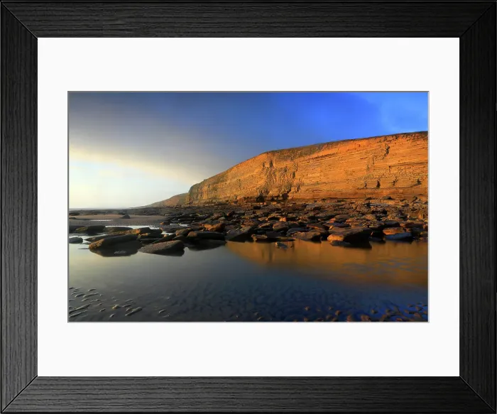 Framed Print : Golden evening light on the cliffs in winter at Dunraven Bay, Southerndown, Bridgend, South Wales, United Kingdom Framed Print : Golden evening light on the cliffs in winter at Dunraven Bay, Southerndown, Bridgend, South Wales, United Kingdom