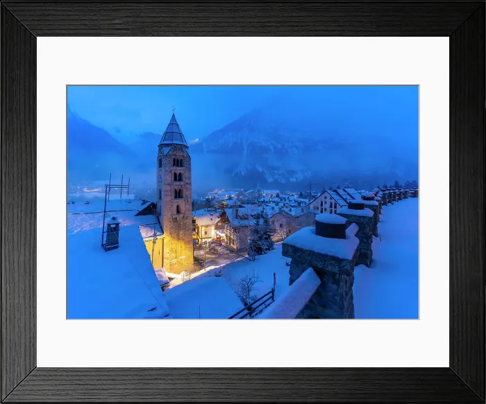 Framed Print : Church of Saint Pantalon and snow covered town centre and mountainous background in winter at dusk, Courmayeur, Aosta Valley, Italian Alps, Italy Framed Print : Church of Saint Pantalon and snow covered town centre and mountainous background in winter at dusk, Courmayeur, Aosta Valley, Italian Alps, Italy