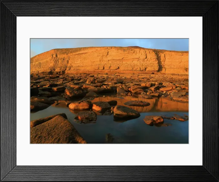 Framed Print : Golden evening light on the cliffs in winter at Dunraven Bay, Southerndown, Bridgend, South Wales, United Kingdom Framed Print : Golden evening light on the cliffs in winter at Dunraven Bay, Southerndown, Bridgend, South Wales, United Kingdom
