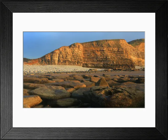 Framed Print : Golden evening light on the cliffs in winter at Dunraven Bay, Southerndown, Bridgend, South Wales, United Kingdom Framed Print : Golden evening light on the cliffs in winter at Dunraven Bay, Southerndown, Bridgend, South Wales, United Kingdom