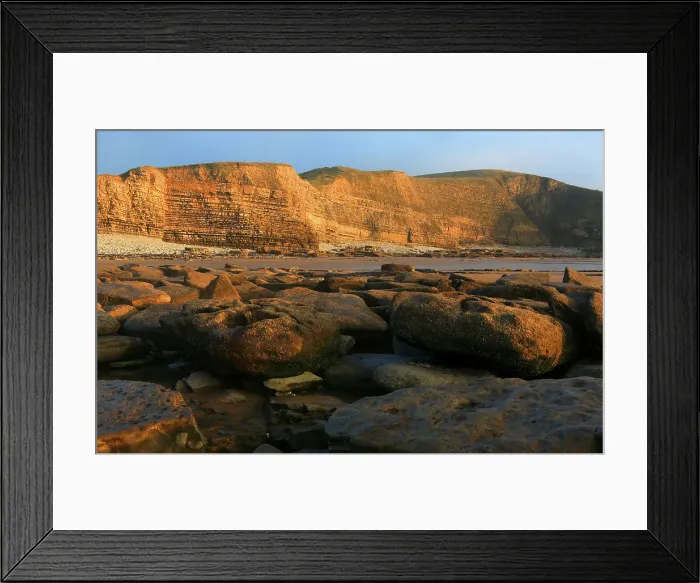 Framed Print : Golden evening light on the cliffs in winter at Dunraven Bay, Southerndown, Bridgend, South Wales, United Kingdom Framed Print : Golden evening light on the cliffs in winter at Dunraven Bay, Southerndown, Bridgend, South Wales, United Kingdom