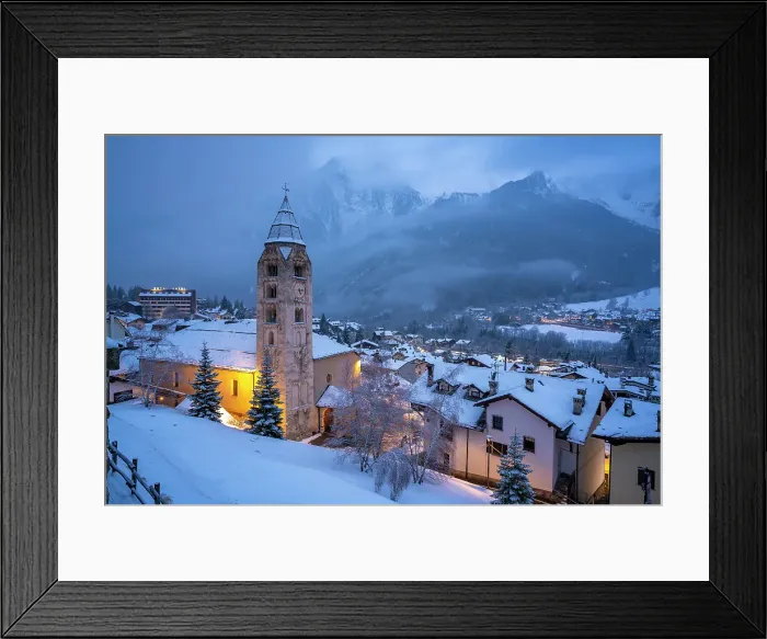 Framed Print : View of Church of Saint Pantalon and the snow covered town centre and mountainous background in winter, Courmayeur, Aosta Valley, Italy Framed Print : View of Church of Saint Pantalon and the snow covered town centre and mountainous background in winter, Courmayeur, Aosta Valley, Italy
