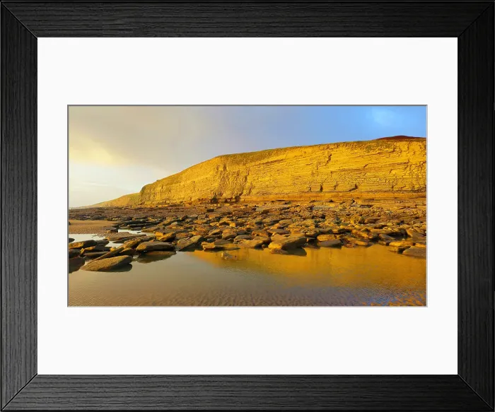 Framed Print : Golden evening light on the cliffs in winter at Dunraven Bay, Southerndown, Bridgend, South Wales, United Kingdom Framed Print : Golden evening light on the cliffs in winter at Dunraven Bay, Southerndown, Bridgend, South Wales, United Kingdom