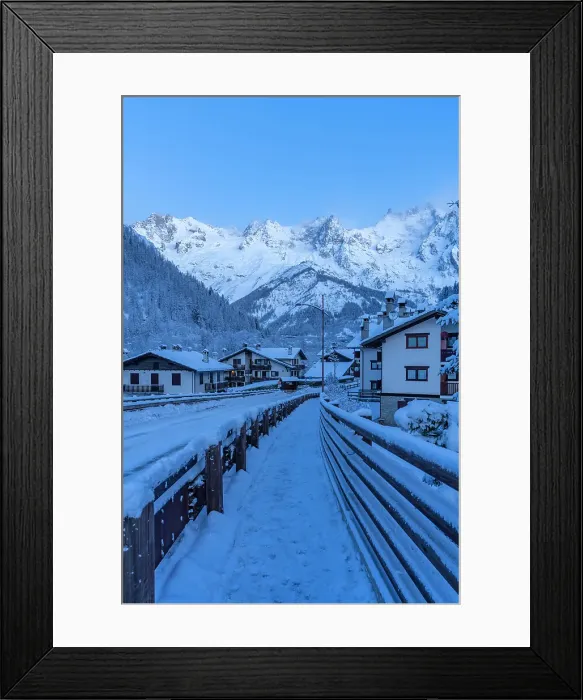 Framed Print : View of chalets and snow covered mountains in Courmayeur before dawn in winter, Courmayeur, Aosta Valley, Italian Alps, Italy