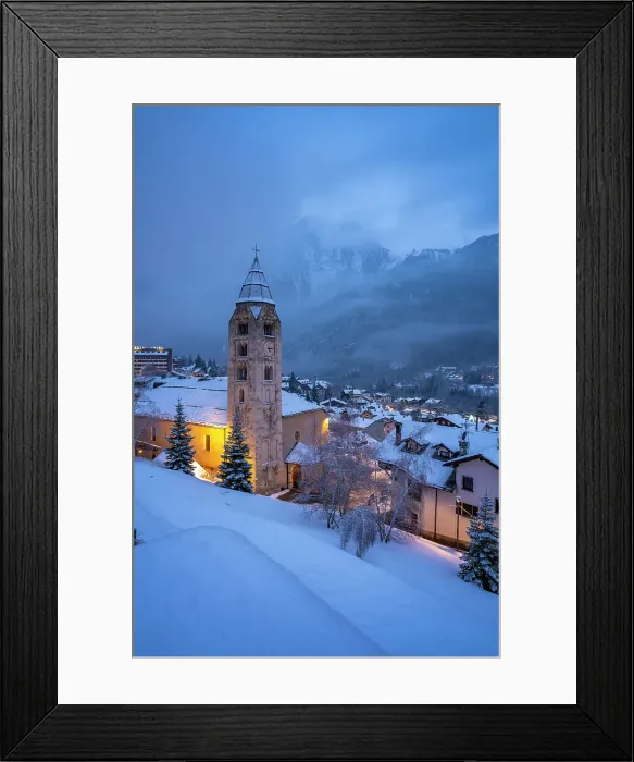 Framed Print : Church of Saint Pantalon, snow covered town centre and mountainous background in winter at dusk, Courmayeur, Aosta Valley, Italian Alps, Italy
