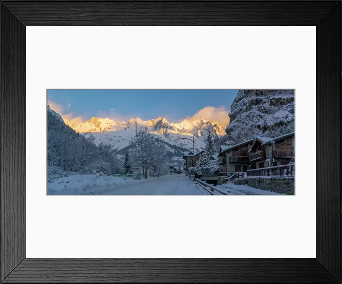 Framed Print : View of hotels, chalets and snow covered mountains in Courmayeur at sunrise in winter, Courmayeur, Aosta Valley, Italian Alps, Italy