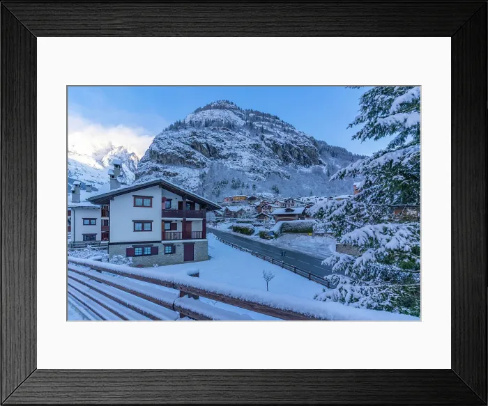Framed Print : View of hotels, chalets and snow covered mountains in Courmayeur at sunrise in winter, Courmayeur, Aosta Valley, Italian Alps, Italy