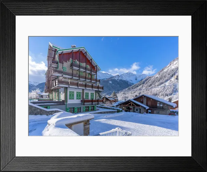 Framed Print : View of chalets and snow covered mountains in Courmayeur at sunrise in winter, Courmayeur, Aosta Valley, Italian Alps, Italy Framed Print : View of chalets and snow covered mountains in Courmayeur at sunrise in winter, Courmayeur, Aosta Valley, Italian Alps, Italy
