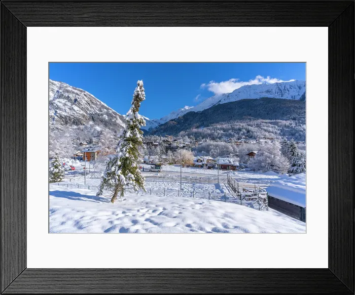 Framed Print : View of snow covered trees, mountains and Courmayeur from Dolonne in winter, Courmayeur, Aosta Valley, Italian Alps, Italy