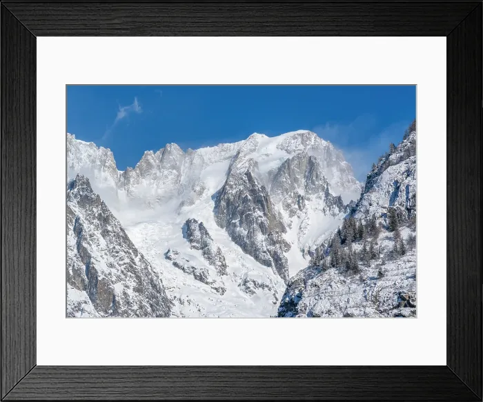 Framed Print : View of snow covered trees, mountains and Courmayeur from Dolonne in winter, Courmayeur, Aosta Valley, Italian Alps, Italy