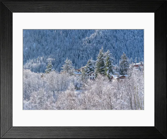 Framed Print : View of snow covered chalets, trees and mountains from Dolonne in winter, Courmayeur, Aosta Valley, Italian Alps, Italy