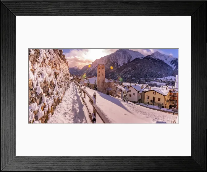 Framed Print : View of snow covered mountains, rooftops and Church of Saint Pantalon in Courmayeur in winter, Courmayeur, Aosta Valley, Italian Alps, Italy Framed Print : View of snow covered mountains, rooftops and Church of Saint Pantalon in Courmayeur in winter, Courmayeur, Aosta Valley, Italian Alps, Italy