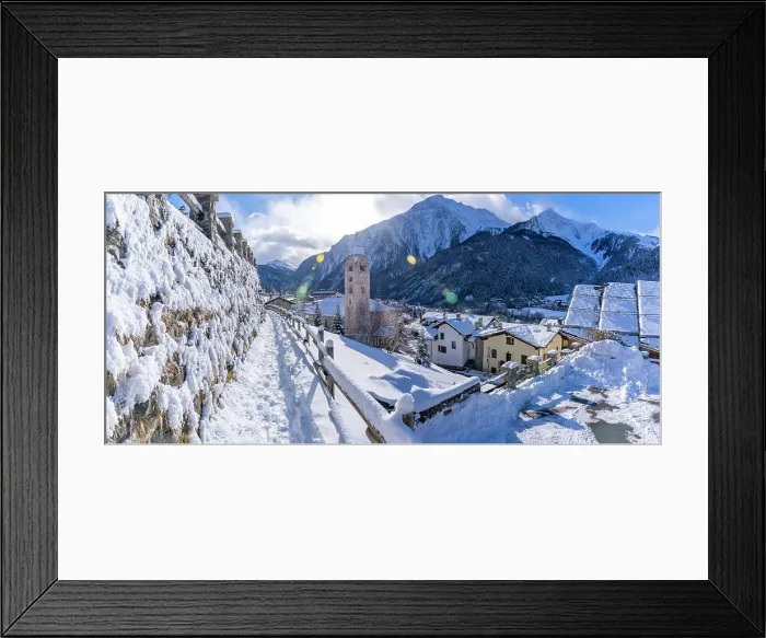 Framed Print : View of snow covered mountains, rooftops and Church of Saint Pantalon in Courmayeur in winter, Courmayeur, Aosta Valley, Italian Alps, Italy Framed Print : View of snow covered mountains, rooftops and Church of Saint Pantalon in Courmayeur in winter, Courmayeur, Aosta Valley, Italian Alps, Italy