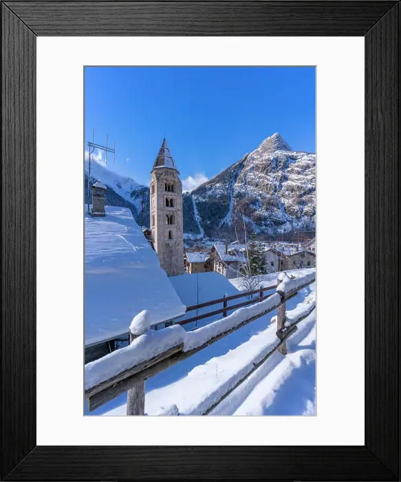Framed Print : View of snow covered mountains, rooftops and Church of Saint Pantalon in Courmayeur in winter, Courmayeur, Aosta Valley, Italian Alps, Italy Framed Print : View of snow covered mountains, rooftops and Church of Saint Pantalon in Courmayeur in winter, Courmayeur, Aosta Valley, Italian Alps, Italy