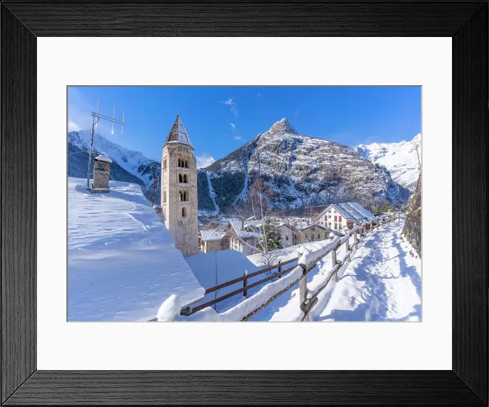 Framed Print : View of snow covered mountains, rooftops and Church of Saint Pantalon in Courmayeur in winter, Courmayeur, Aosta Valley, Italian Alps, Italy Framed Print : View of snow covered mountains, rooftops and Church of Saint Pantalon in Courmayeur in winter, Courmayeur, Aosta Valley, Italian Alps, Italy