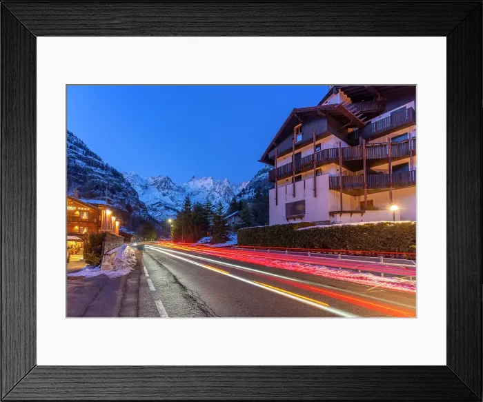 Framed Print : View of snow covered mountains and trail lights in Courmayeur at dusk in winter, Courmayeur, Aosta Valley, Italian Alps, Italy Framed Print : View of snow covered mountains and trail lights in Courmayeur at dusk in winter, Courmayeur, Aosta Valley, Italian Alps, Italy