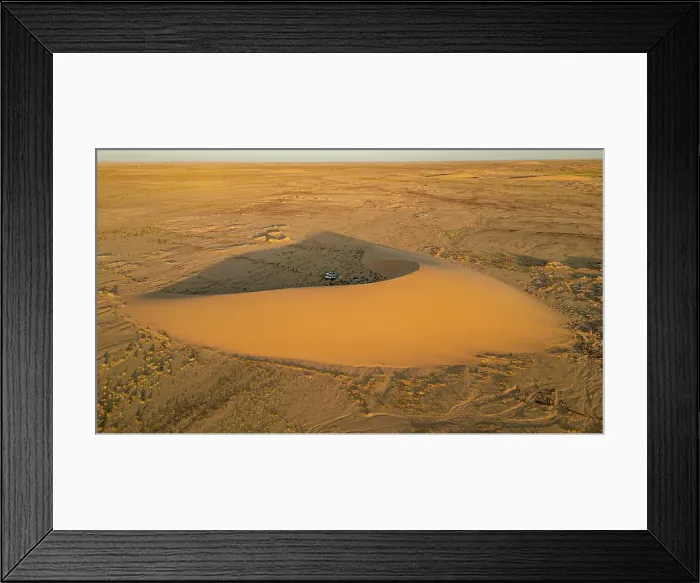 Framed Print : Aerial of sunset over a beautiful sand dune in the Tibesti Mountains, Chad Framed Print : Aerial of sunset over a beautiful sand dune in the Tibesti Mountains, Chad