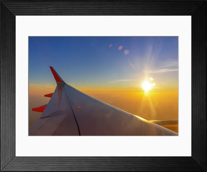 Framed Print : Aircraft plane wing, sunburst, sunset over England, United Kingdom Framed Print : Aircraft plane wing, sunburst, sunset over England, United Kingdom