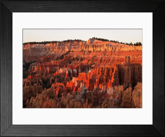 Framed Print : Warm light envelops majestic rock formation in Bryce Canyon National Park during a summer day, Utah, United States of America