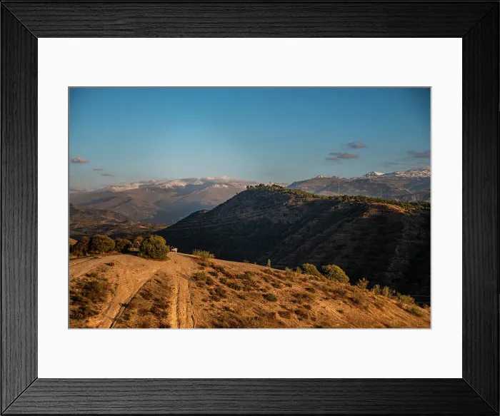Framed Print : Sunset over arid hilly landscape in front of the snowy Sierra Nevada, Albaicin, Granada, Andalucia, Spain Framed Print : Sunset over arid hilly landscape in front of the snowy Sierra Nevada, Albaicin, Granada, Andalucia, Spain
