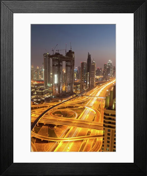 Framed Print : Dubai skyline and night traffic on busy intersection on Sheikh Zayed highway, Dubai, United Arab Emirates