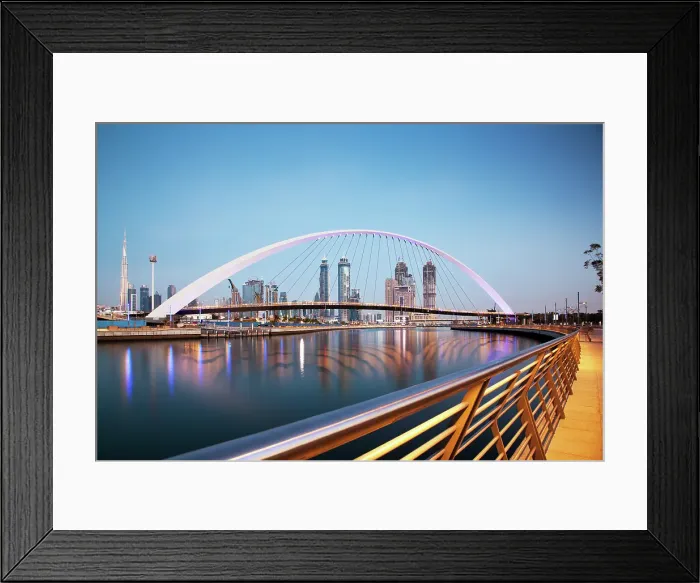 Framed Print : Colorful sunset over Dubai Downtown skyscrapers and newly built Tolerance bridge viewed from Dubai water canal, Dubai, United Arab Emirates Framed Print : Colorful sunset over Dubai Downtown skyscrapers and newly built Tolerance bridge viewed from Dubai water canal, Dubai, United Arab Emirates