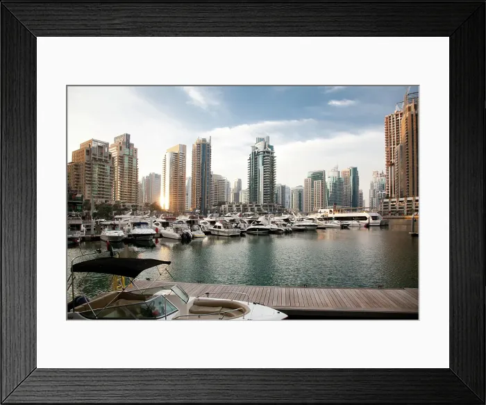 Framed Print : View of modern skyscrapers shining in sunrise light in Dubai Marina in Dubai, United Arab Emirates Framed Print : View of modern skyscrapers shining in sunrise light in Dubai Marina in Dubai, United Arab Emirates