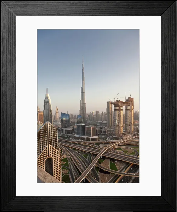 Framed Print : Dubai skyline at sunset with Burj Khalifa, the world tallest building and Sheikh Zayed road traffic, Dubai, United Arab Emirates